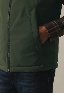 Omkeerbare bodywarmer met hoge kraag Bodywarmers